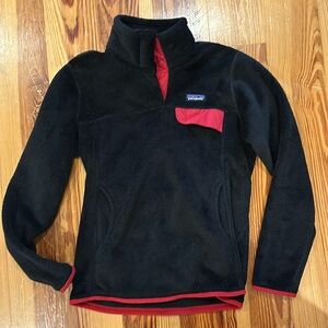 New women’s Patagonia black fleece with red details-size medium